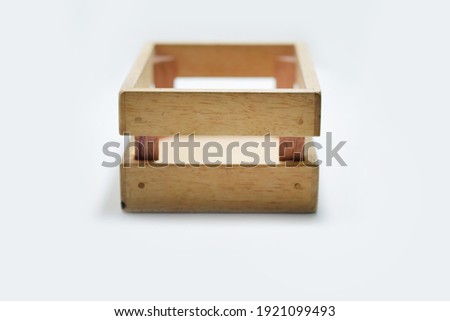 Selective Focus of A Wooden Box for Toys Isolated with White Background 