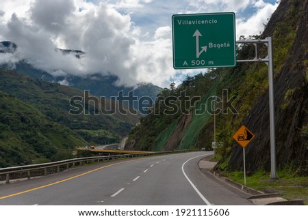Road signs in the city of Villavicencio on a road that borders the mountains. Colombia . Royalty-Free Stock Photo #1921115606