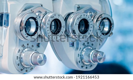 Phoropter, ophthalmic testing device machine, Side view of vintage ophthalmic bio microscope or slit lamp, Test and measurement of myopia and long sight. Royalty-Free Stock Photo #1921166453