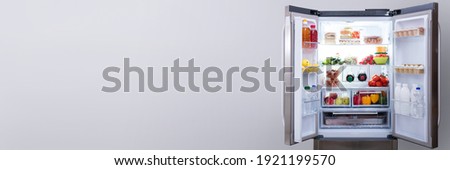 Full Open Refrigerator Or Fridge In Kitchen Royalty-Free Stock Photo #1921199570
