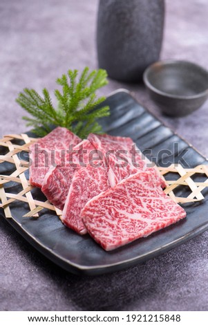 Premium Rare Slices many parts of Wagyu A5 beef with high-marbled texture on stone plate served for Yakiniku (Grilled Meat). Royalty-Free Stock Photo #1921215848