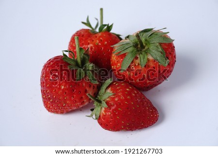 strawberry isolated on white background. Four strawberry In the center of the image to good the picture. Shoot naturally Does not decorate pictures.