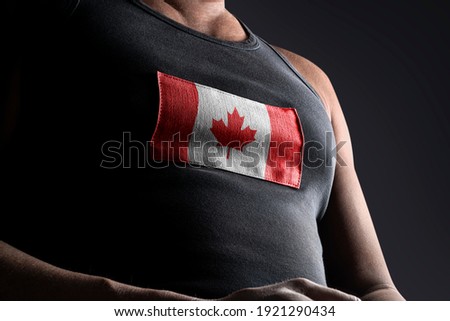 The national flag of Canada on the athlete's chest