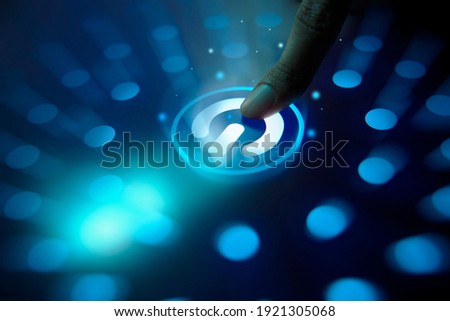 Digitization Idea, Human hand pressing start button to power on the newest technology, Artificial Intelligence, Futuristic, Machine Learning, Launching futuristic machine, People living with Machine Royalty-Free Stock Photo #1921305068