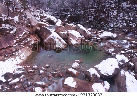 Water stream and rocks in the snowy mountain. Winter landscape at Mt Seoraksan, South Korea.