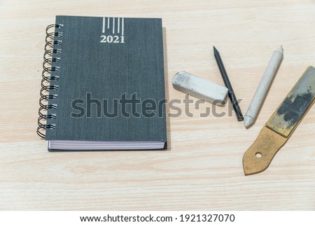 background wooden texture free space for text with calendar pencil and rubber