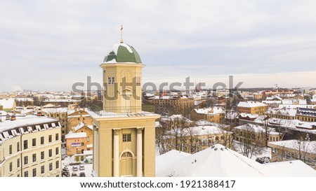 Riga, Latvia, Baltics.Beautiful panoramic aerial view photo from flying drone to Lutheran church of Jesus on a sunny winter day. (Series)