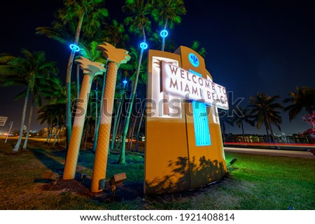 Welcome to Miami Beach sign at night