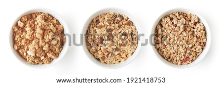 Set of whole grain muesli in white bowl isolated on white background, top view Royalty-Free Stock Photo #1921418753