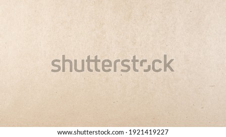 Abstract brown recycled paper texture background.
Old Kraft paper box craft pattern.
top view.