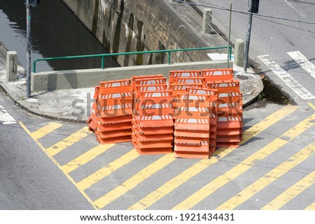 Stack of orange cones for traffic closure on city street