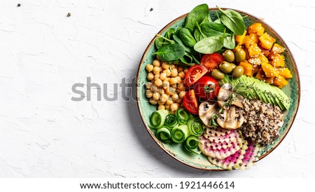 vegan bowl. Avocado, quinoa, sweet potato, tomato, spinach and chickpeas vegetables salad. Buddha Bowl. Long banner format, top view. Royalty-Free Stock Photo #1921446614