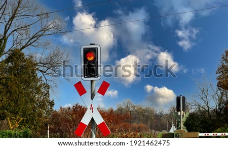 Railroad crossing and blue sky