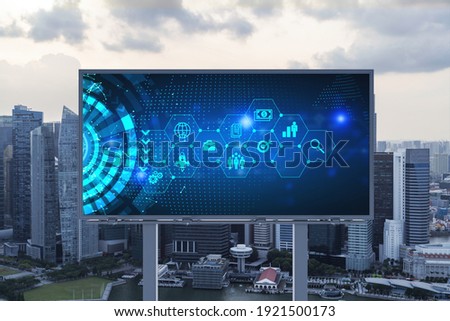 Hologram of Research and Development glowing icons on billboard. Sunset panoramic city view of Singapore. Concept of innovative technologies to create new services and products in Southeast Asia.