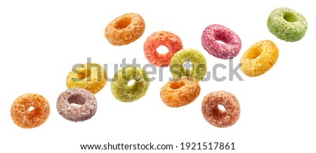 Falling colorful corn rings isolated on white background with clipping path Royalty-Free Stock Photo #1921517861