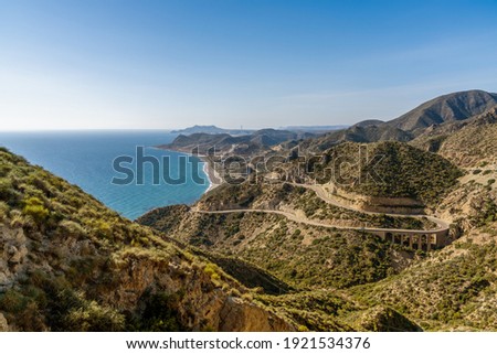 Scenic winding mountain road on the Costa de Almeria in southern Spain Royalty-Free Stock Photo #1921534376