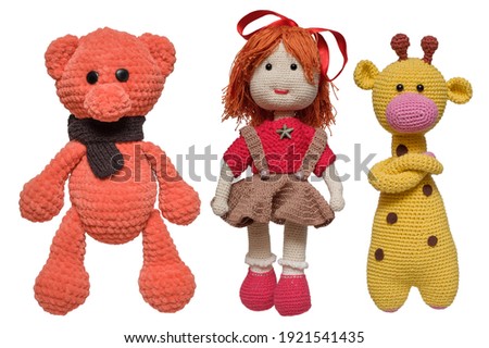 Three knitted toys. Isolated on white background.