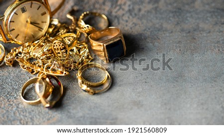 Old and broken jewelry, vintage watches on dark background. Sell  gold  for cash concept.  Royalty-Free Stock Photo #1921560809
