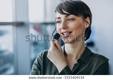 Young woman with microphone working on record studio Royalty-Free Stock Photo #1921604534