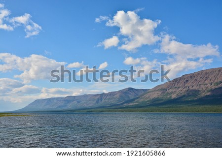 Lake in the Putorana plateau. Water summer landscape in the North of Eastern Siberia in Russia.