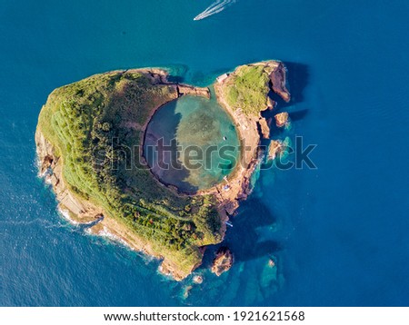 Azores aerial panoramic view. Top view of Islet of Vila Franca do Campo. Crater of an old underwater volcano. Sao Miguel island, Azores, Portugal. Heart carved by nature. Bird eye view. Royalty-Free Stock Photo #1921621568