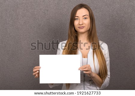 Medical worker doctor or nurse showing empty white board with copy space for text or design