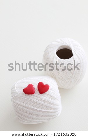 white crochet yarn with red hearts