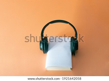 concept of audiobooks book and headphones. 