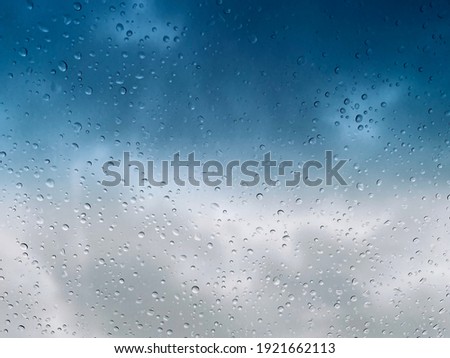 Close up of water droplets collecting on glass.