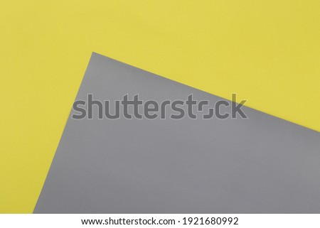 Illuminating yellow and Ultimate Gray pastel paper texture background, Geometric flat lay background.