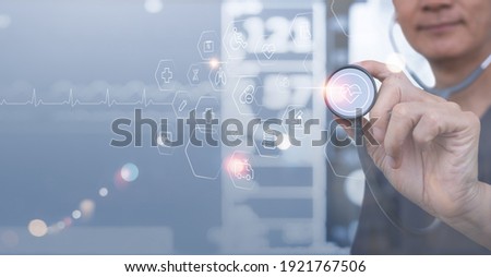 Medical technology background, virtual hospital, smart health, telemedicine concept. Doctor with stethoscope touching on medical technology icons on modern virtual screen, vital signs monitor data 
