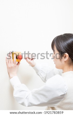 Woman trying to press the emergency switch