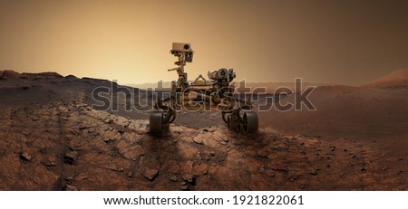  Mars 2020 Perseverance Rover is exploring surface of Mars. Perseverance rover Mission Mars exploration of red planet. Space exploration, science concept. .Elements of this image furnished by NASA. Royalty-Free Stock Photo #1921822061