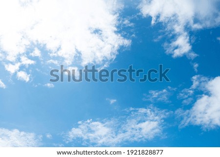 Blue sky with large clouds, close up. Beautiful background