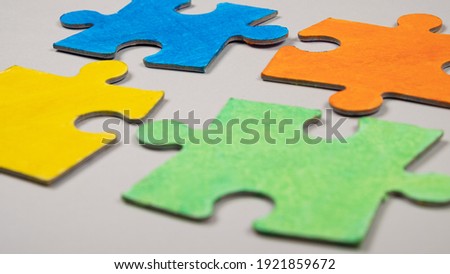child autism symbol, colored puzzles, inclusive education.