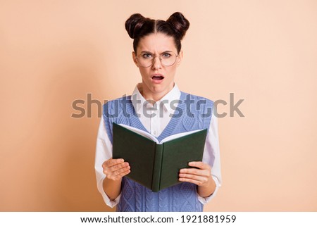Photo of brunette stressed lady read book wear spectacles white shirt blue vest isolated on beige color background