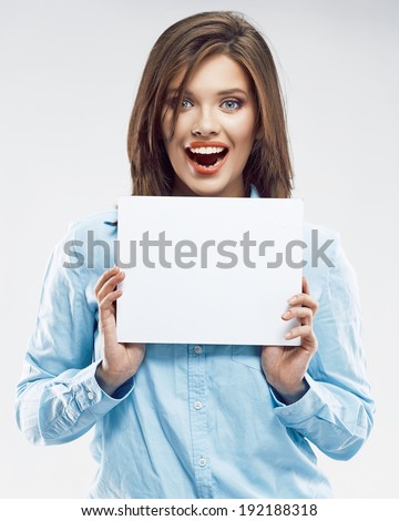 Beautiful young business woman portrait. Smiling girl show white card.