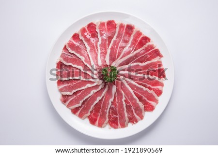 Thinly sliced beef served with hot pot 