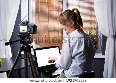 Caucasian woman in white shirt leads a business hour with employees filming the work process. Online business promotion. High quality photo