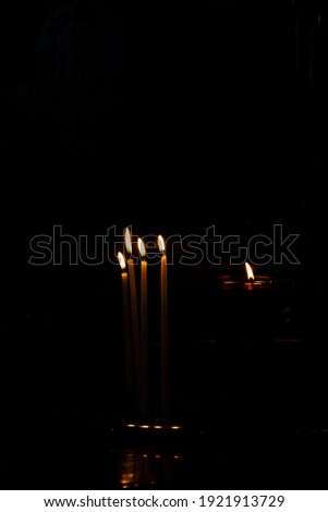 candle light burning in the dark