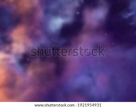 Blurred bright navy blue and purple universe background with mist and cloud. Abstract gradient galaxy backdrop with blur and bokeh.