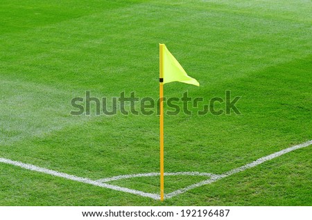 Yellow corner flag on an soccer field 