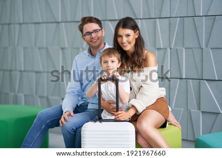 Picture of family waiting in hotel lobby