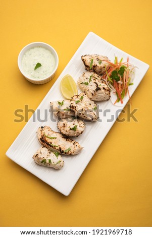 Indian Afghani chicken Malai Tikka is a grilled Murgh creamy kabab served with fresh salad Royalty-Free Stock Photo #1921969718