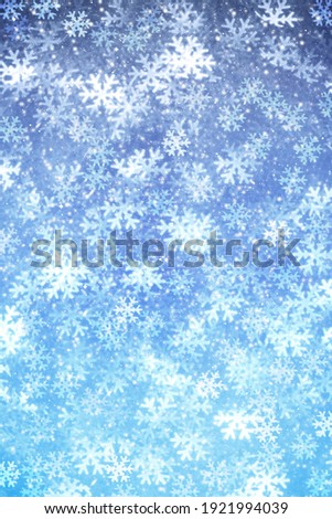 Snowflake shaped bokeh. Combined with blue background.
