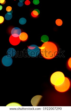 Colorful shiny bokeh lights. New year celebration lights. Cell phone wallpaper. Story background.