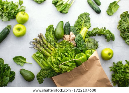 Green vegetables in a paper shopping bag, top-down view, sustainable living concept Royalty-Free Stock Photo #1922107688