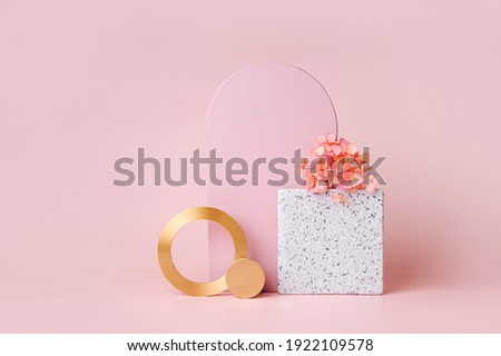 Pink arch and golden rounds with flowers on a pink background.  Stylish  background with geometric shapes for cosmetic product presentation