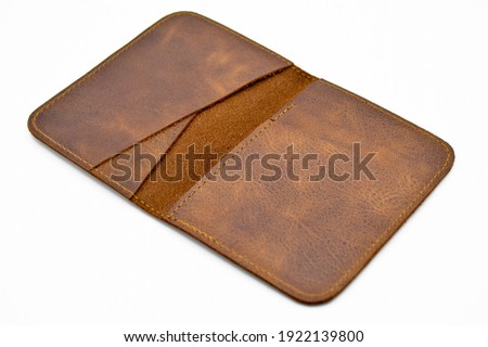 Very stylish brown leather money and credit card wallet, isolated on white background