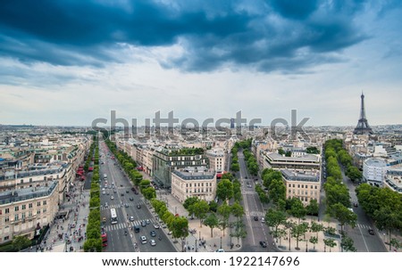 View of the Champs-Elysees with the The Eiffel Tower in the background, seen from the Arc de Triomphe in the afternoon